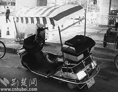 摩托车上盖篷子合理不合法被拆除(图)